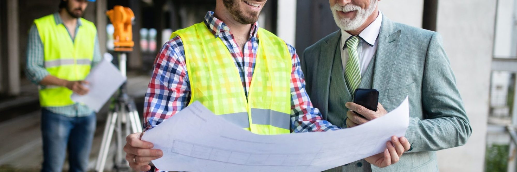 engineer-foreman-and-worker-discussing-in-building-construction-site-3-e1600417370299.jpg